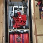 11.5 Engine space showing all bulkheads and engine bearers. Exhaust system, shaft,wiring loom,fuel tank, fuel lines, water strainer all installed. Whipstaff ans engine control cables still to be installed