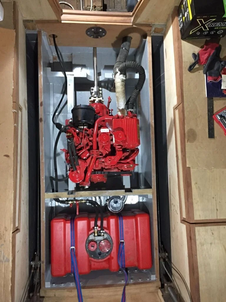 11.5 Engine space showing all bulkheads and engine bearers.  Exhaust system, shaft,wiring loom,fuel tank, fuel lines, water strainer all installed.  Whipstaff ans engine control cables still to be installed