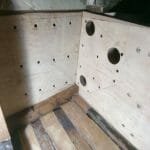 3.3 Inside the boat on the port side - holes prepared in the transverse bulkhead and the inboard keel bow panel - to accept the three dimensional stainless steel keel support bracket