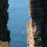 "Gellie II" motorsails past the Old Man of Hoy, Orkney
