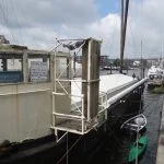 Noble Masts - an historic name in hollow mast making - operate from two barges