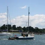 A119 Walrus leaving  Hamble Point Marina on her way home to Chichester in 2005.