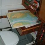 Chartable slides away under the cockpit to reveal a heads.