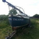 Stout looking trailer but the hull needs attention. 2015