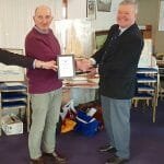 Atalanta Trophy - RIchard James, A89 Colchide, receives the wooden model of A12 for winning the East Coast Race.