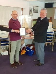Atalanta Trophy - RIchard James, A89 Colchide, receives the wooden model of A12 for winning the East Coast Race.