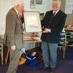 Sinclair Tophy - Colin Tywford, ex Commodore, Secretary and owner of A95 Hiran, receives the painting of A71 for services to the AOA.