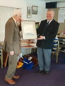 Sinclair Tophy - Colin Tywford, ex Commodore, Secretary and owner of A95 Hiran, receives the painting of A71 for services to the AOA.