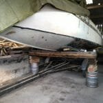 The precarious bit - high enough to get the trailer out without touching the barrels or beams!