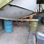 Safely resting on oil drums to give clear access to the hull.