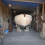 A1 at rest in the shed where she has been for 18 months receiving new keel boxes, skin grafts and hole repairs.