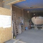 View of the workshop with the plans on the door.