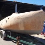 A1 sitting on Totora's old trailer which replaces traditional athwartship chocks with fore-and-aft rails on the bilge.