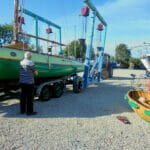 Threading the hoist past trailer