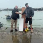 Ryan gratefull receiving the new rudder blade from Chris, of Park Farm Joinery.