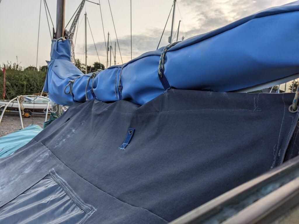 Cockpit-tent-attachment-to-boom-over-mainsail-cover