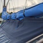 Cockpit-tent-attachment-to-boom-over-mainsail-cover